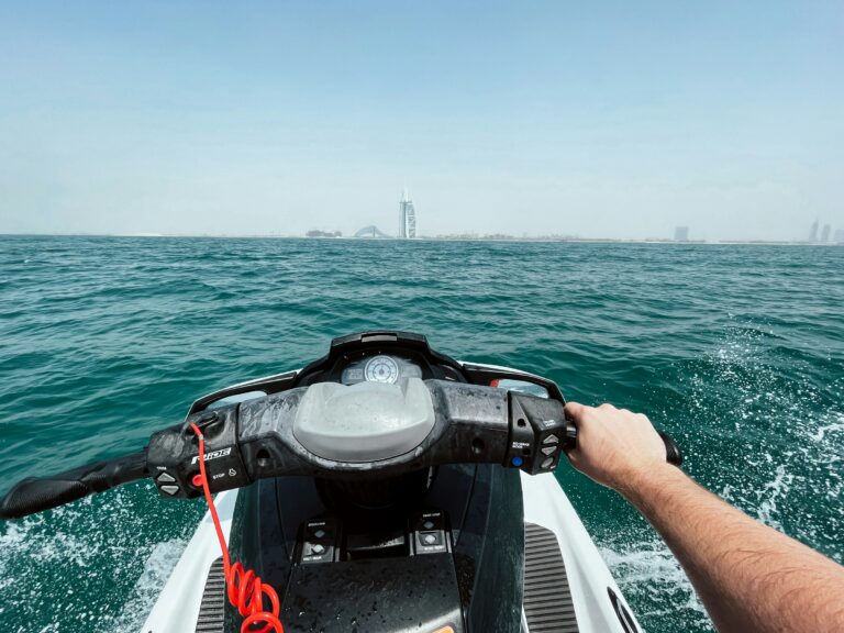 Dubai jet ski rider heading across the water towards Burj Al Arab