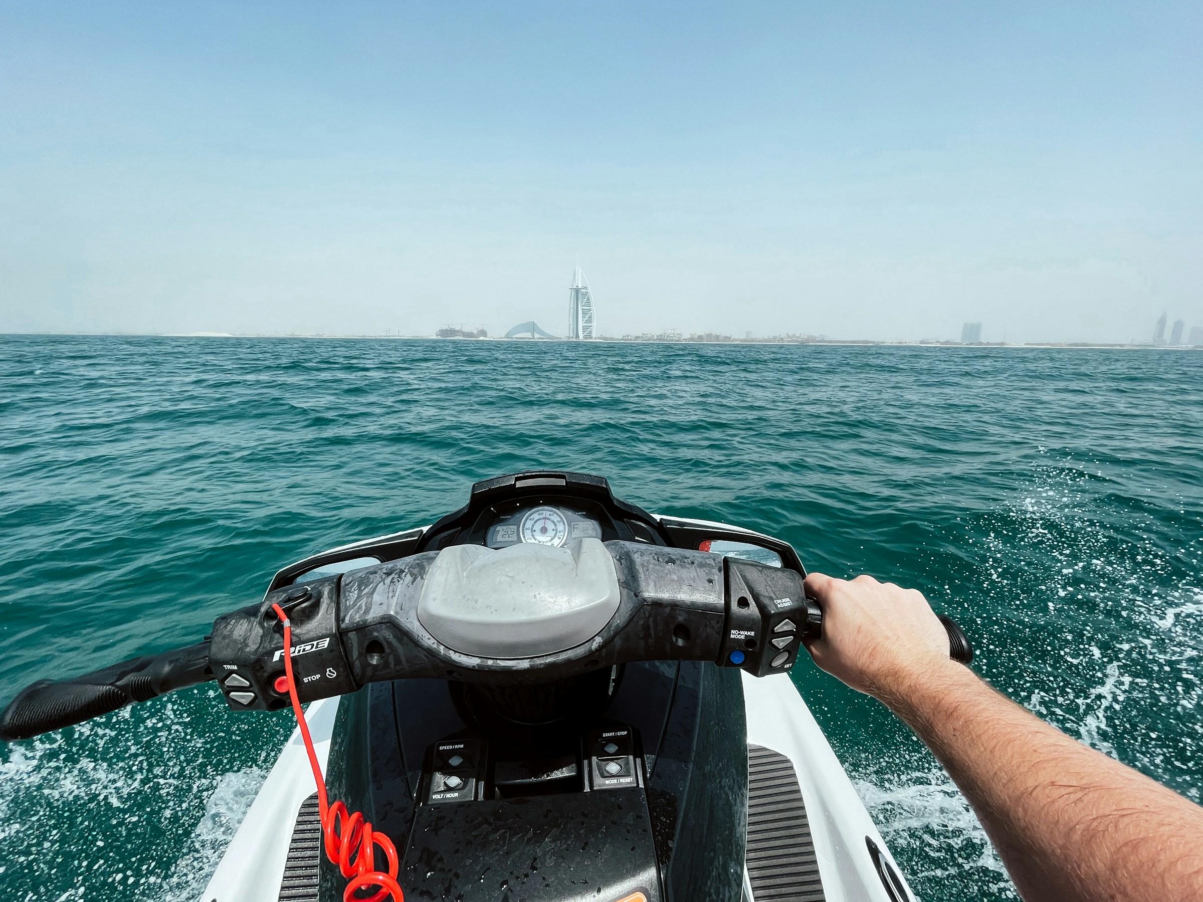 Dubai jet ski rider heading across the water towards Burj Al Arab